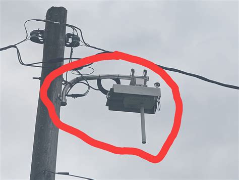 black box on electric pole|mystery box on utility pole.